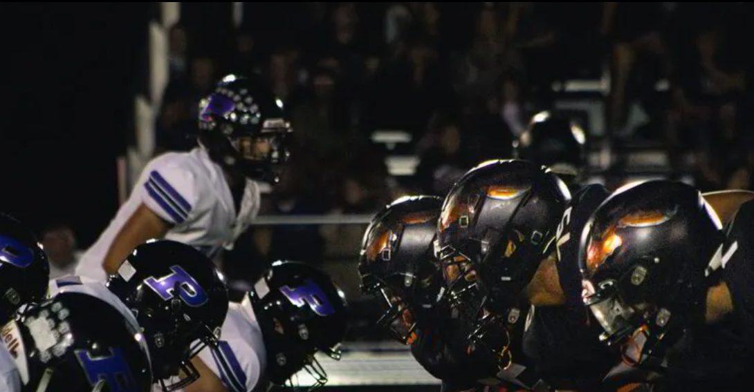 Sandwich Indians football under the lights